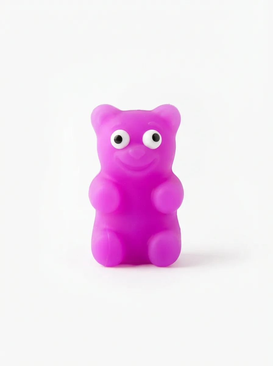A single neon purple NeeDoh Gummy Bear centered on a white background, showcasing its full shape and smiling face.